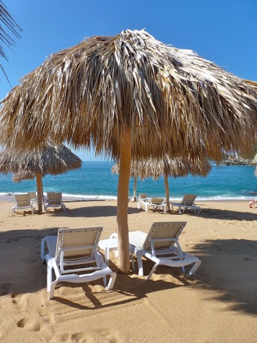 Huatulco lounger Loungers on the beach at Secrets Huatulco.