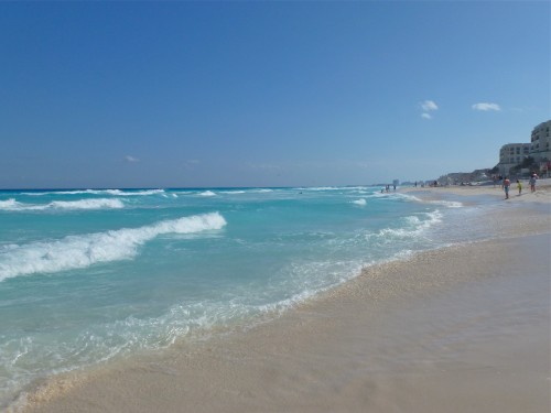 Endless view of the water and sand of the Caribbean Sea at Cancun, Mexico. 