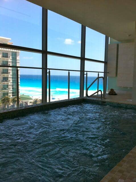 Pool at Pevonia spa with view of the Caribbean at Secrets The Vine Cancun. 