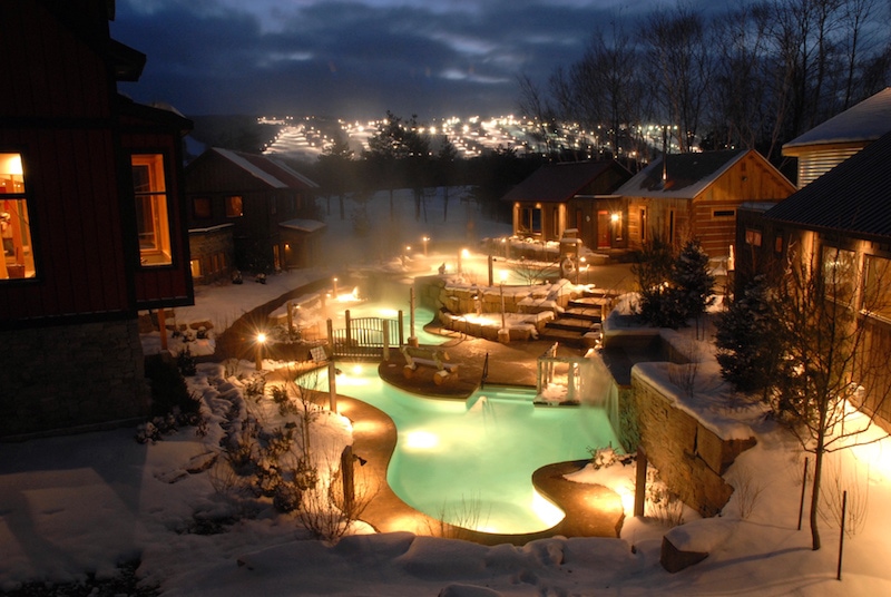 Enjoy views of the illuminated ski slopes at Scandinave Spa Blue Mountain. Photo Credit by Robert Burcher.