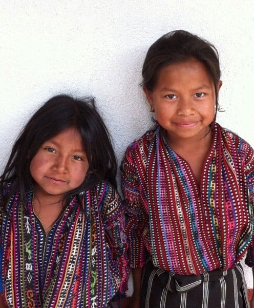 Two young girls in typical Mayan dress in Solola Guatemala