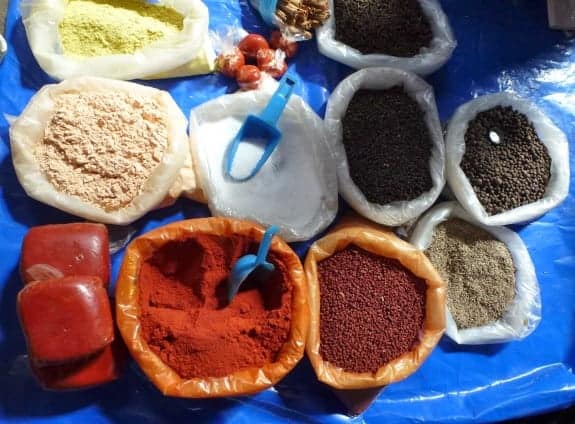 Bags of achiote and other spices in Solola Market in Guatemala. 