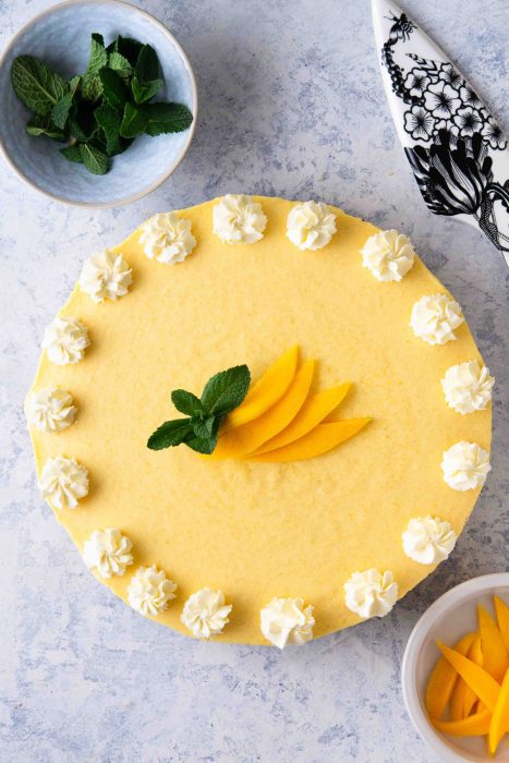No-Bake Mango Pie with a decorative serving lifter and mint 