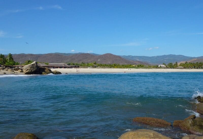Distant view of Roca Blanca Beach in Oaxaca, Mexico. 