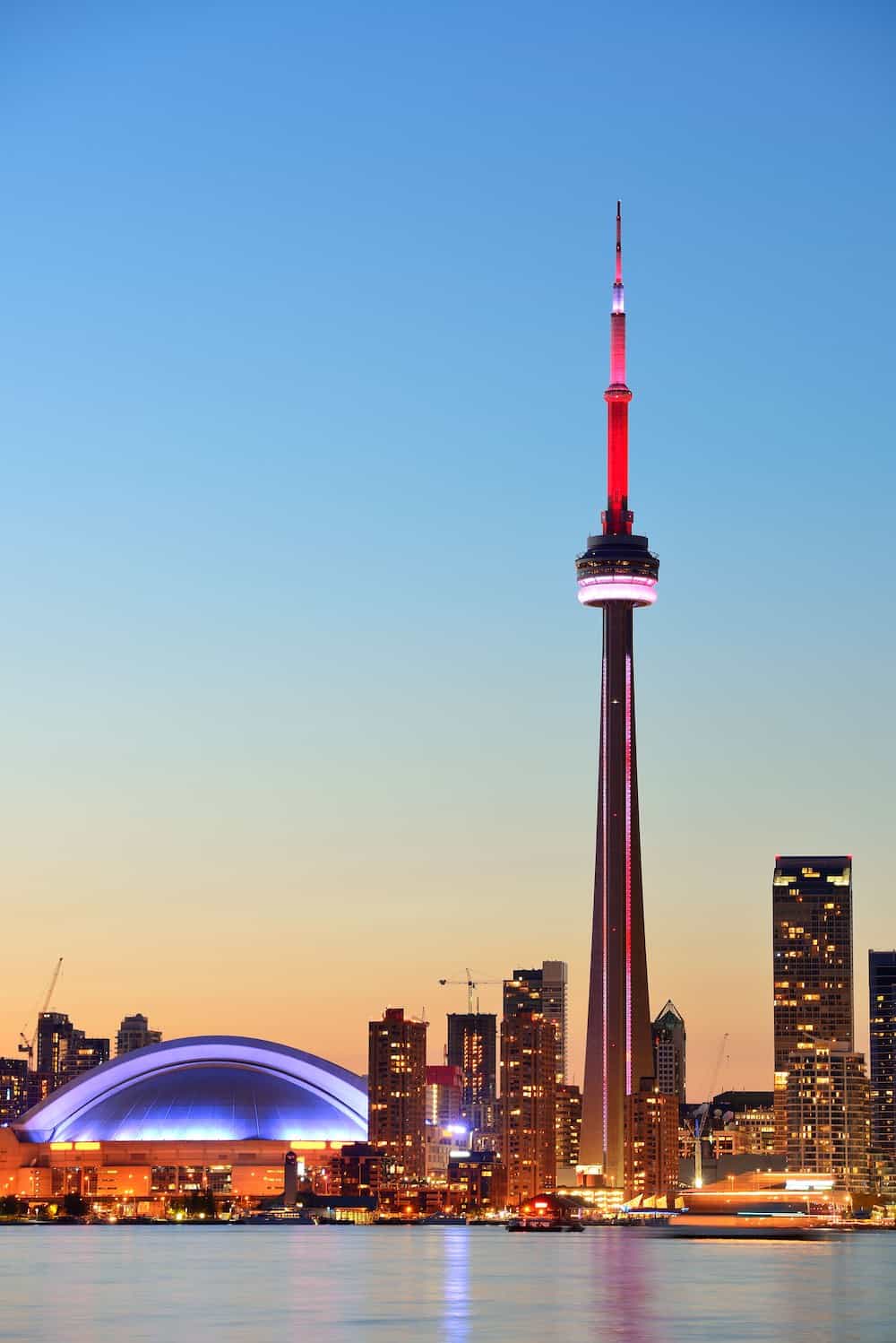 View of Toronto skyline at sunset from the water.