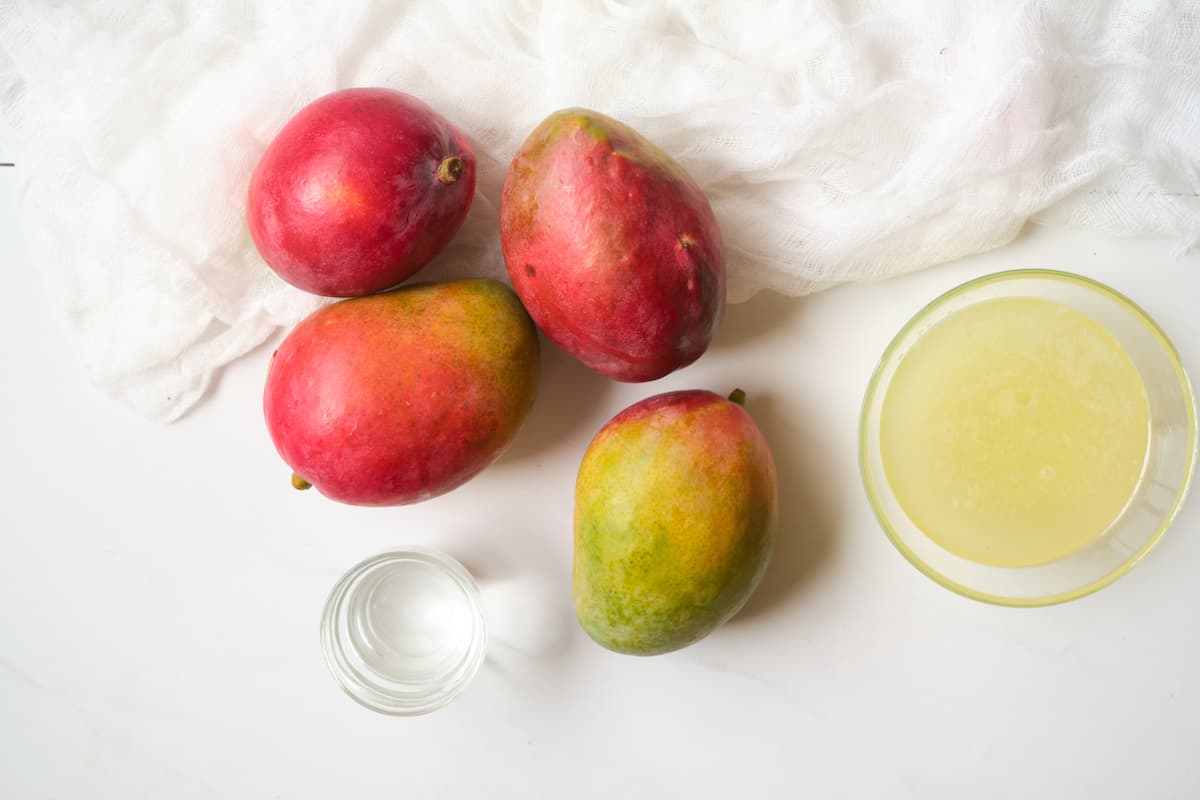 Mangoes, lemonade and tequila for making a copycat Hotel California cocktail.