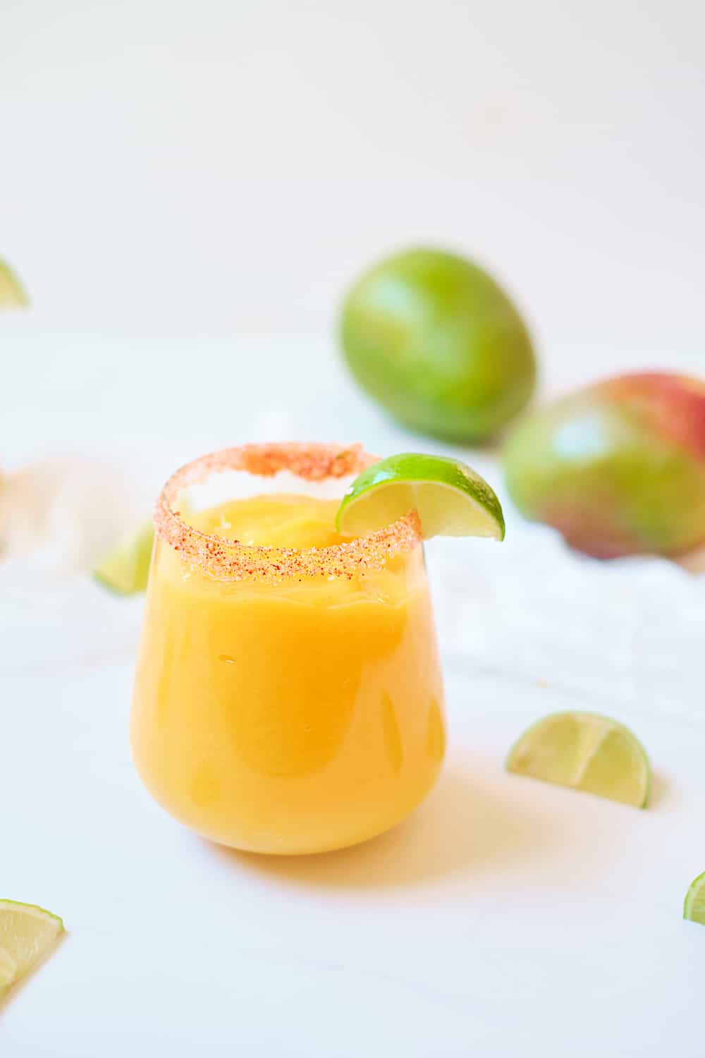 Portrait of a Los Cabos spicy cocktail garnished with fresh lime.