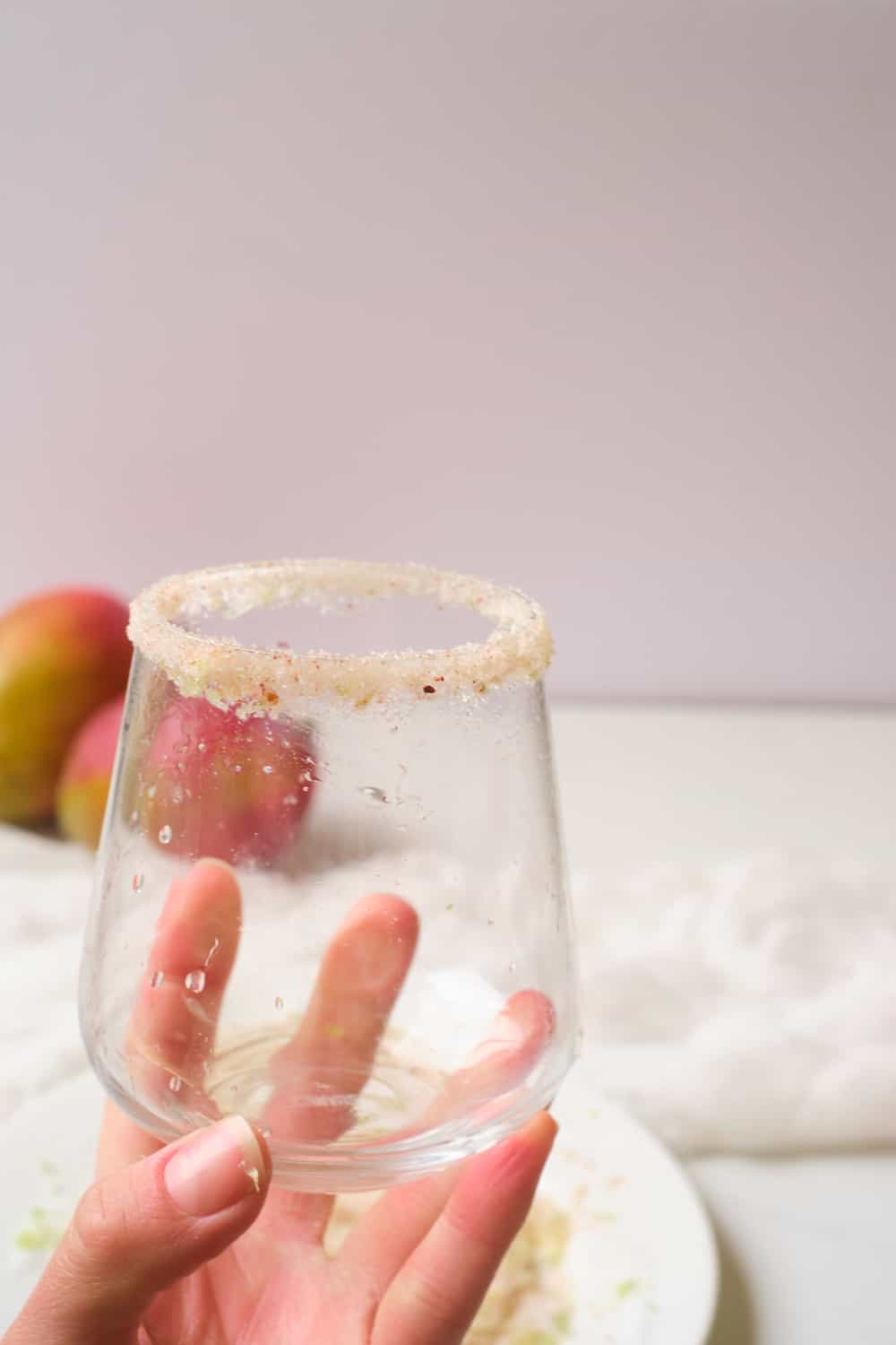 Chili salt on rim of a cocktail glass.