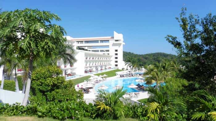 View of one of the swimming pools you'll access on a day pass at Secrets Huatulco Resort.