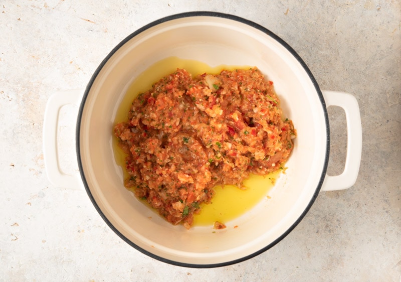 Guatemalan sofrito cooking in a pot for tapado seafood soup. 