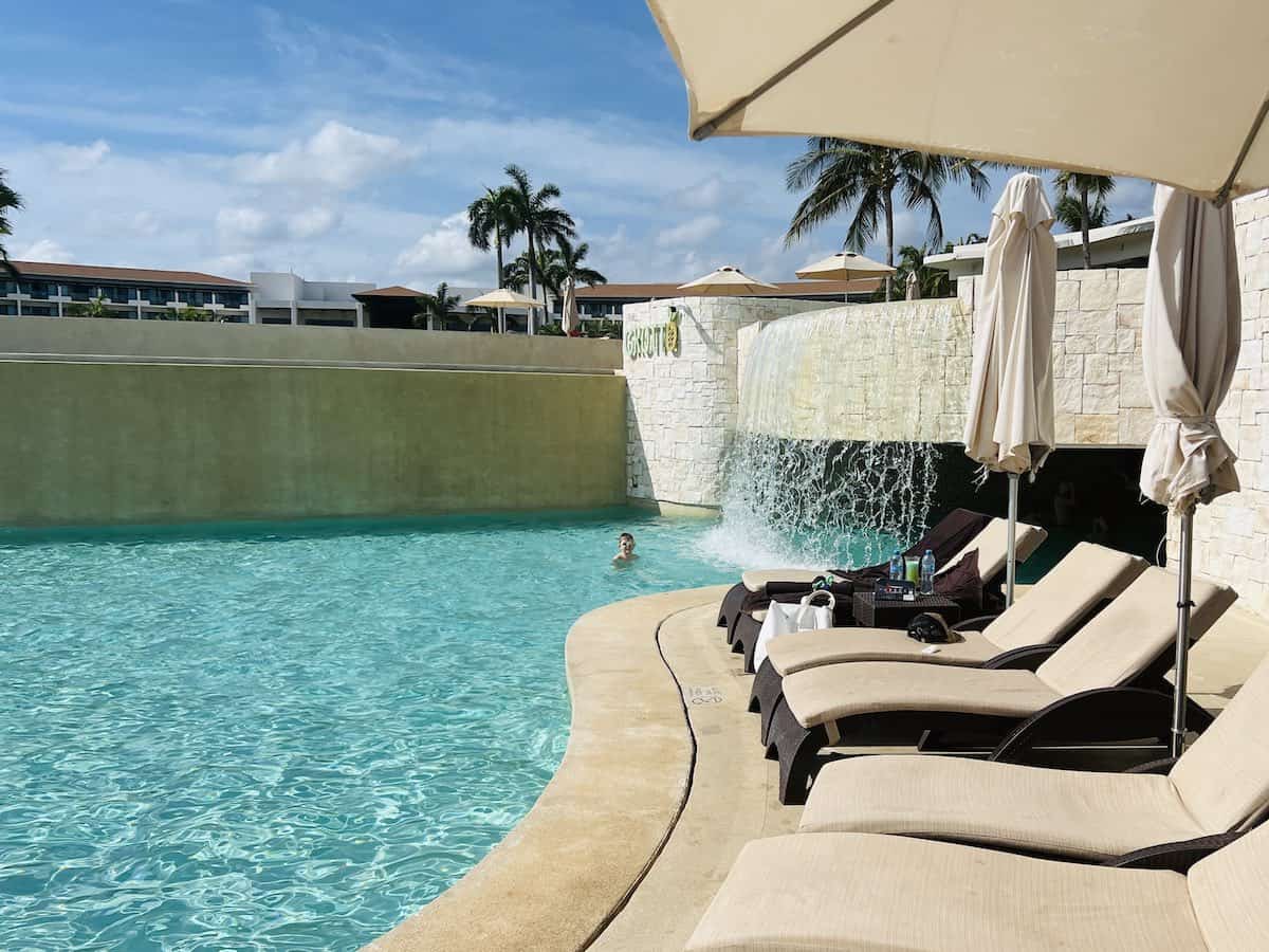 Grotto swim up bar with waterfall at Dreams Playa Mujeres.