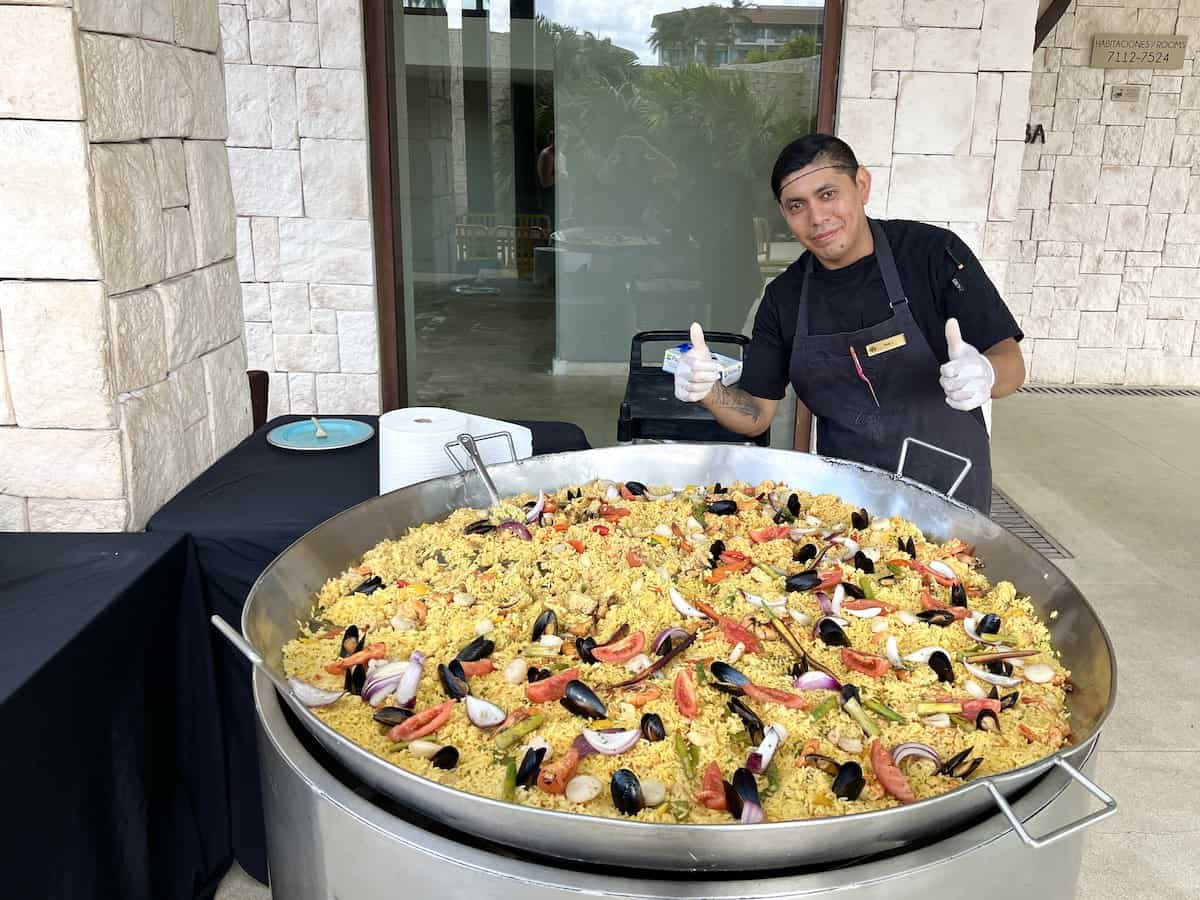 Server with giant paella at Dreams.
