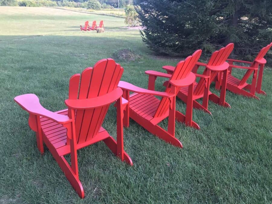 Red adirondack chairs in Peterborough & The Kawarthas.