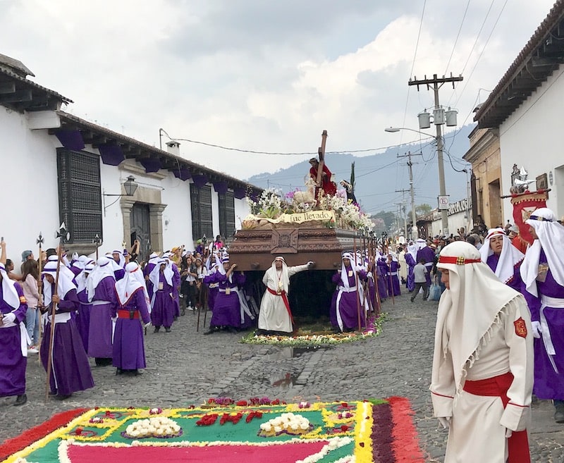 A religious procession and an alfombra (carpet) during a Guatemala Festival at Easter. 