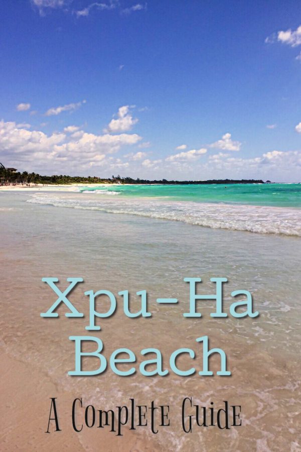 Sand and blue waters with text overlap of Xpu-Ha Beach 