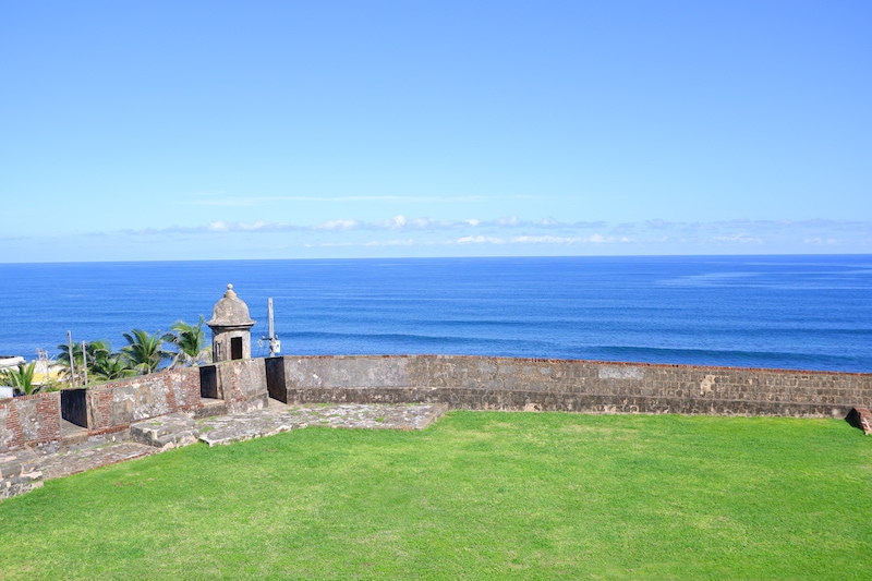 Fort El Morro overlooking the ocean with green grass in Puerto Rico.