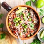 A bowl of Guatemalan shredded beef salad on the table.