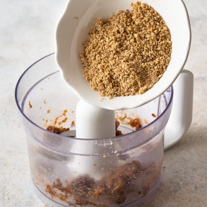 Blend the Medjool dates with walnuts in a food processor