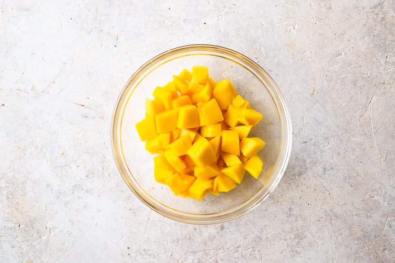 Chopped fresh mango for Coconut Mango Panna Cotta