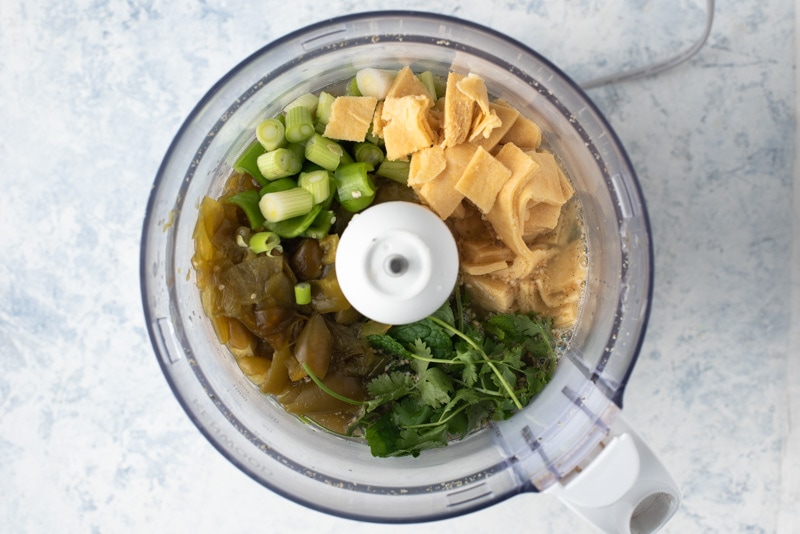 Processing the ingredients for jocon or salsa verde in a food processor. 