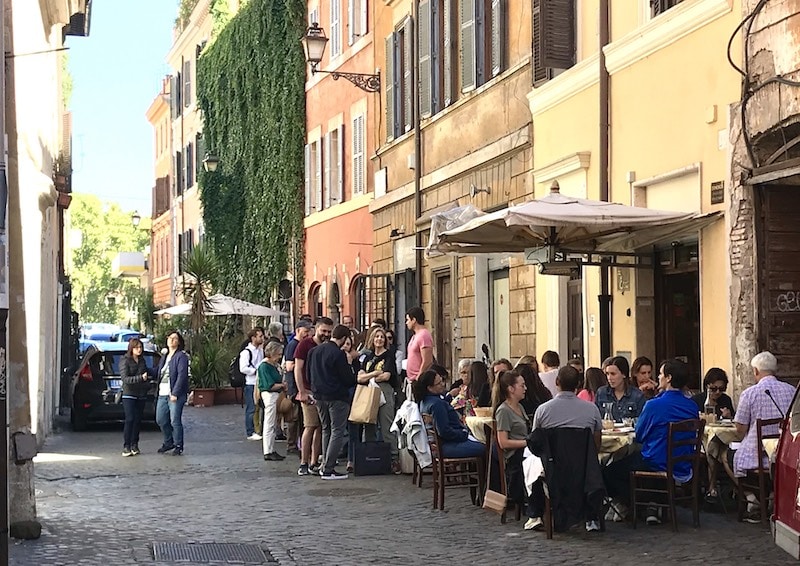 Lineups at the popular Da Enzo Restaurant in Rome.
