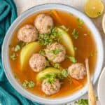 Healthy meatball soup in a bowl with turkey meatballs and chayote.