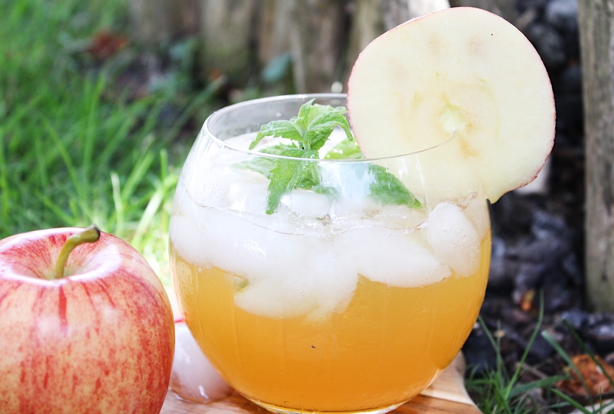 Apple cider mojito in a glass outdoors 