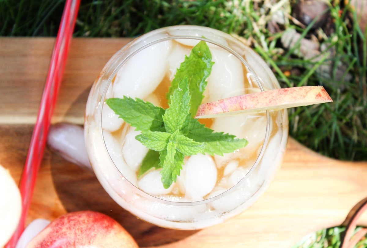 overhead shot of an apple mojito with a sprig of mint. 