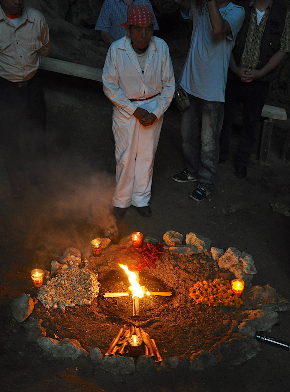 A shaman conducts a Mayan ceremony in a sacred cave near Coban, Guatemala.