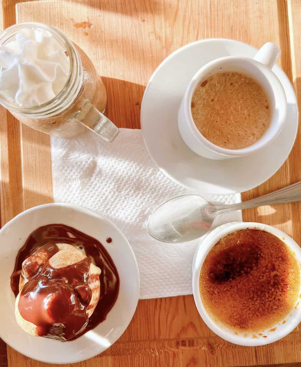 Mousse de chocolate, the profiteroles or the crème brûlée on a table..
