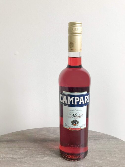 Bottle of Campari on a table. 