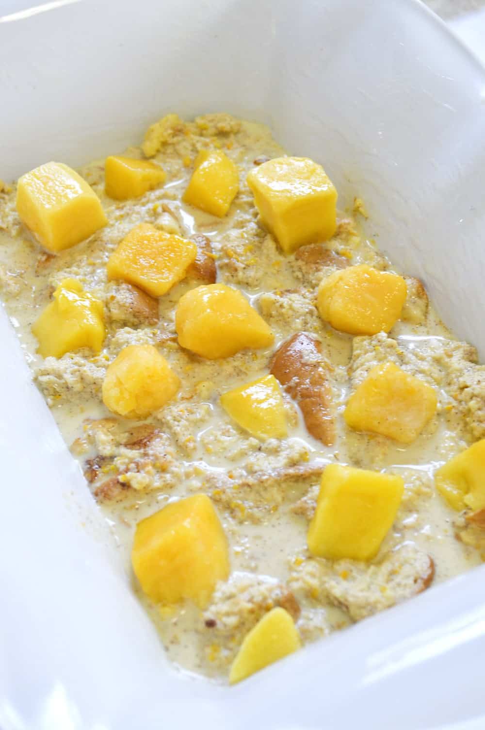 Mango chunks layered in the bread pudding. 