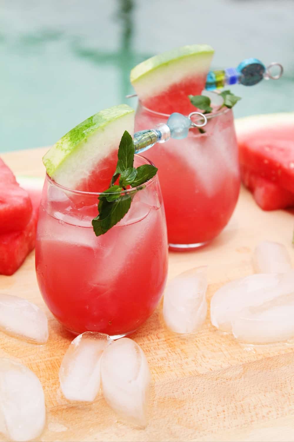 two glasses of a vodka and watermelon cocktail with ice. 