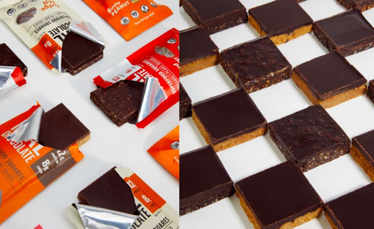 Packages of Mid-Day Squares on a white table.