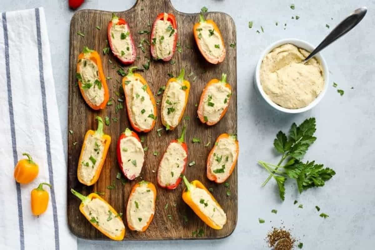A tray of hummus stuffed bell peppers.