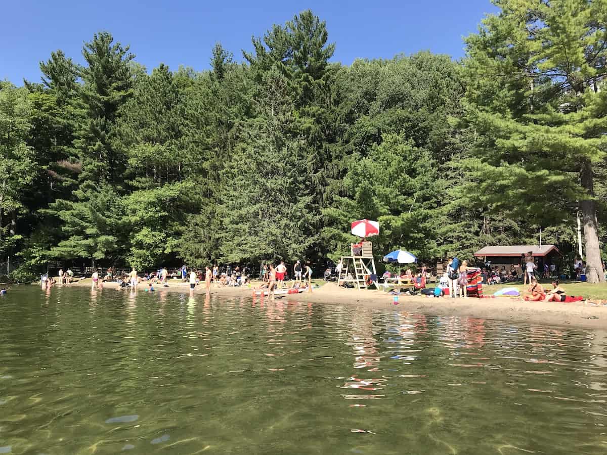 People on a beach in the summer at OBrien Beach.