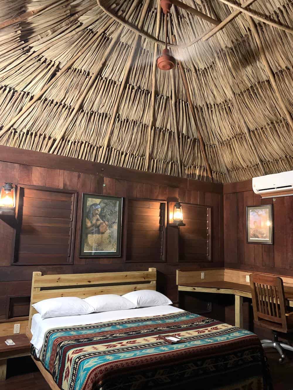 Interior of a thatched roof cabana at Lamanai Outpost Lodge in Belize..