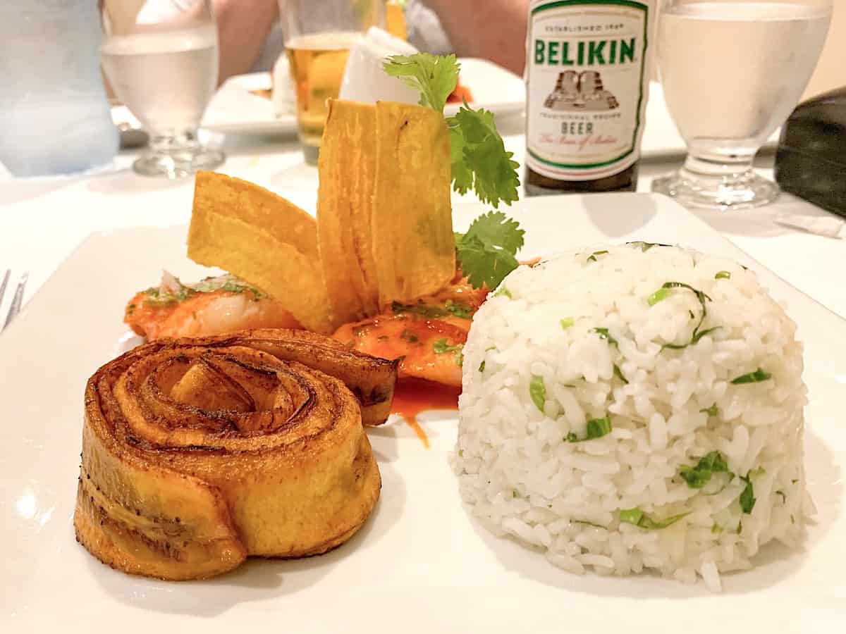 Red snapper with plantain on a white plate.