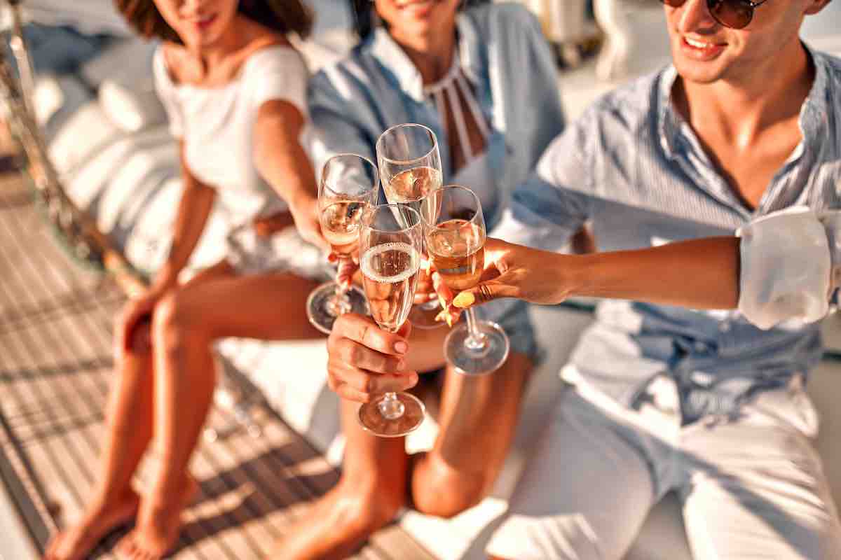People enjoying drinks on a boat. 