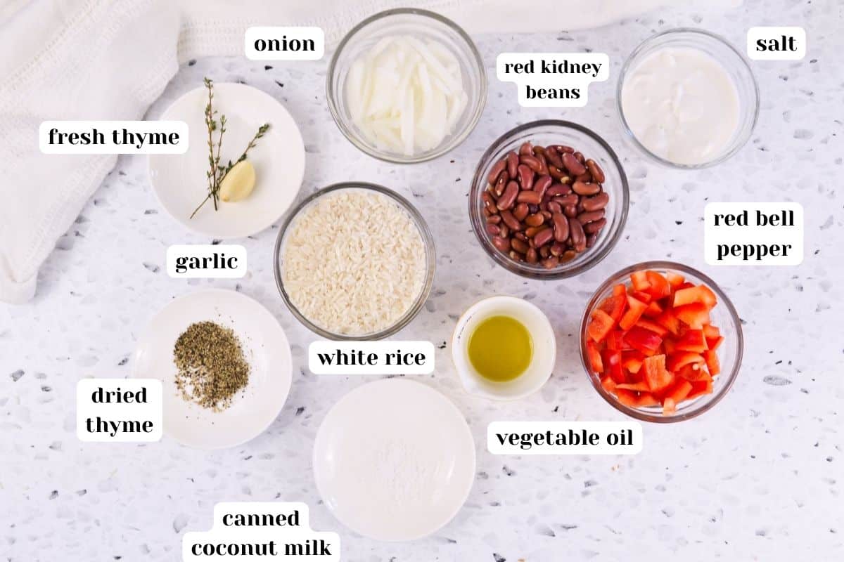 Dried red kidney beans, garlic, white rice, vegetable oil, red pepper, white onion, thyme and coconut are the key ingredients in vegetarian red beans with coconut rice.
