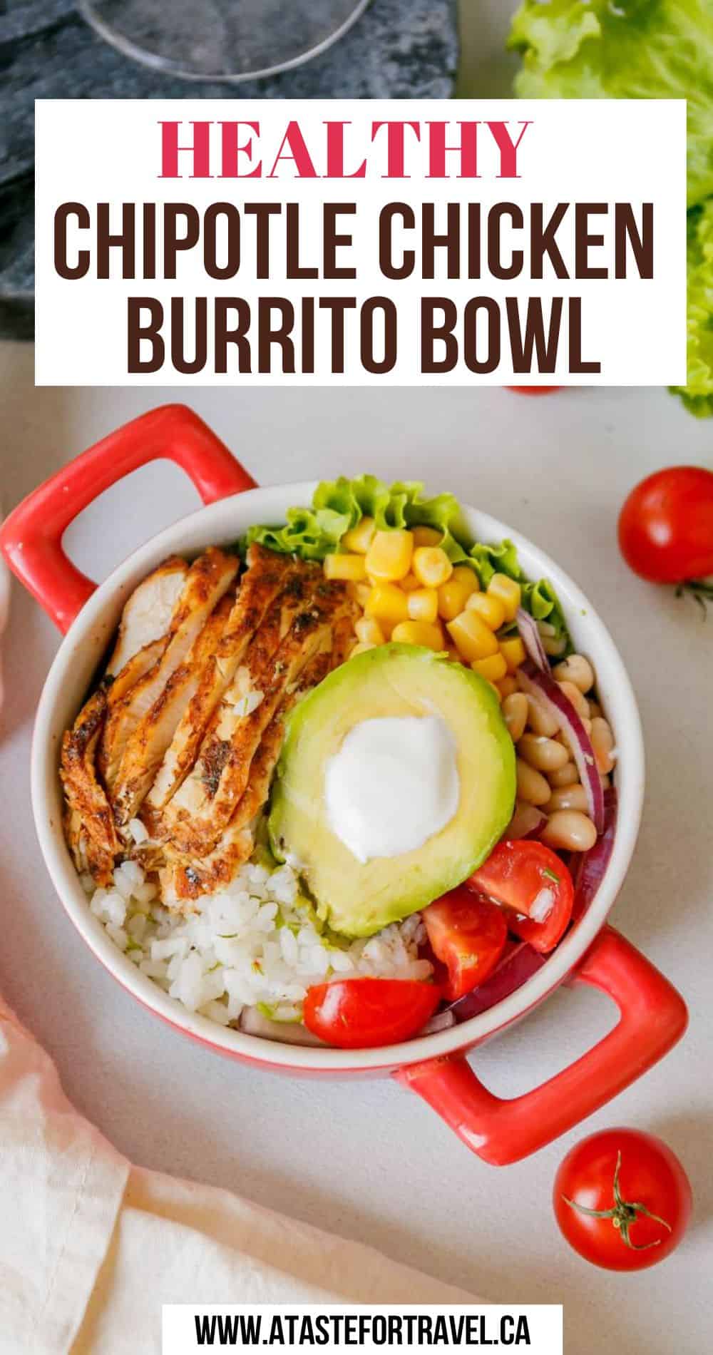 Overhead image of a chipotle chicken rice bowl in a red serving dish on a white background.