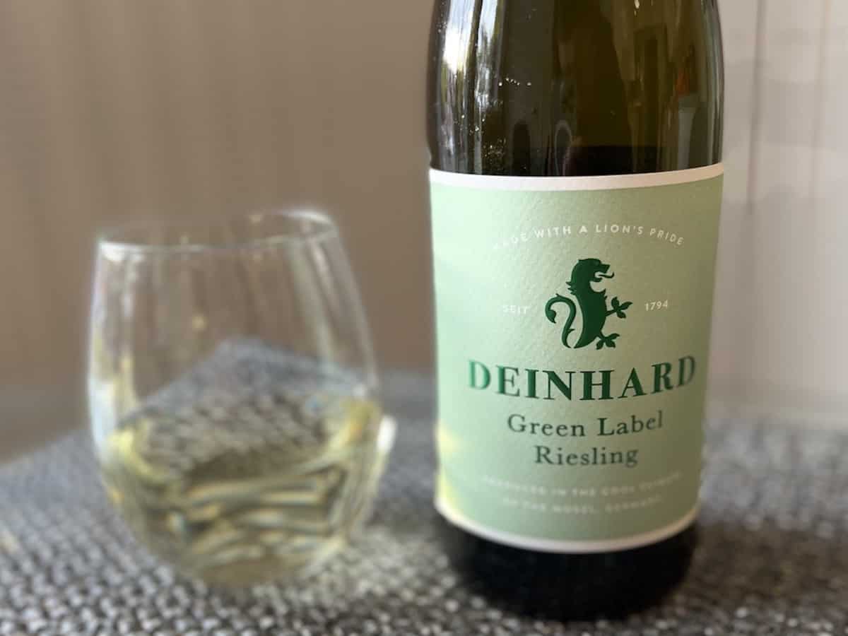 A bottle of Riesling and a glass of wine.