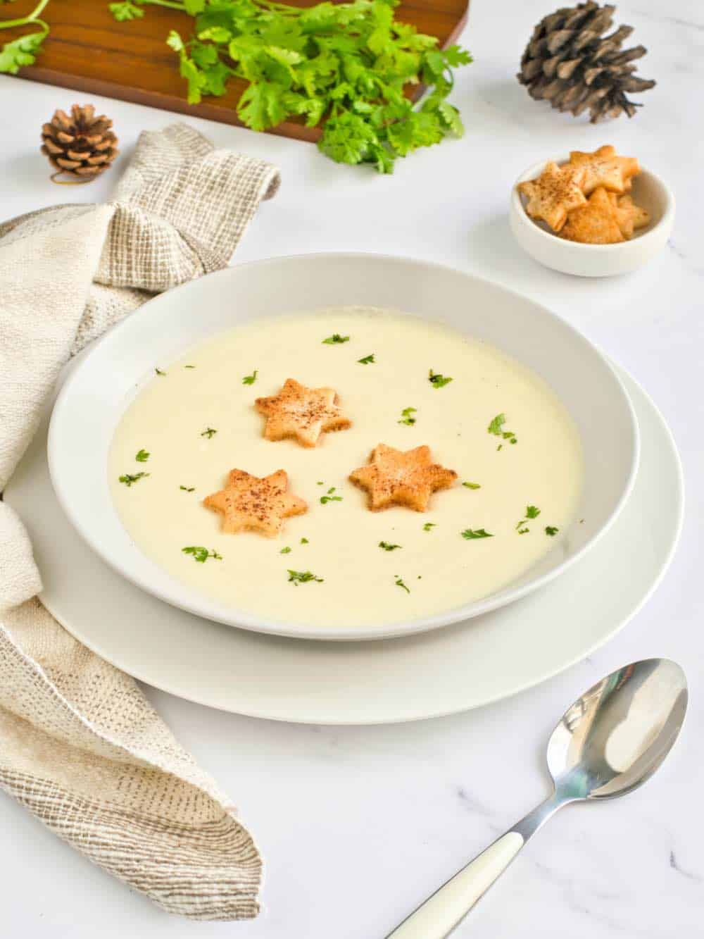 Portrait of Riesling and potato in a white bowl. 