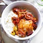 Spanish chicken and Chorizo Stew in a white bowl.