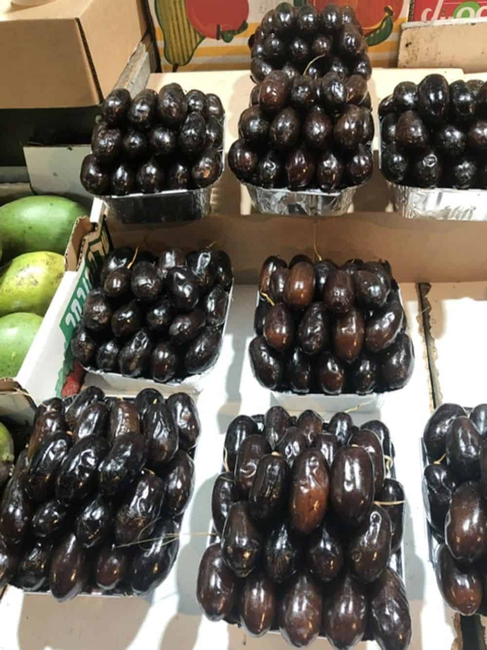 Dates in boxes for sale on table.