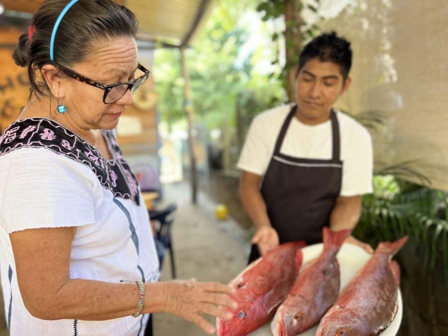 Gina Machorro selecting fish at El Horno Escondido.