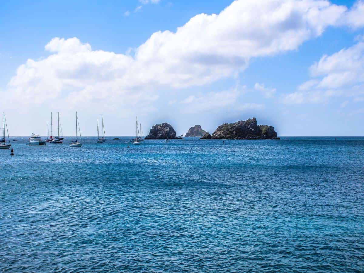 Catamarans in ocean with rocks. Catamarans in ocean with rocks.