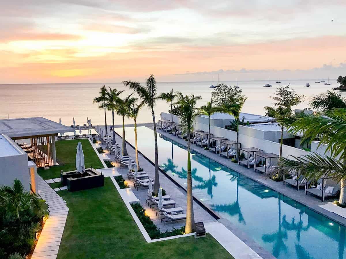 A beautiful view of sunset overlooking the swimming pool at Silversands resort in Grenada.