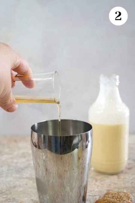 Pouring the alcohol into the shaker.