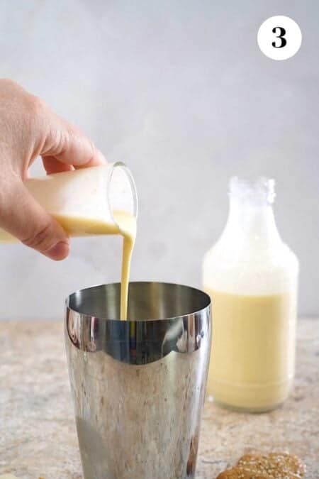 Adding the eggnog to the shaker glass.